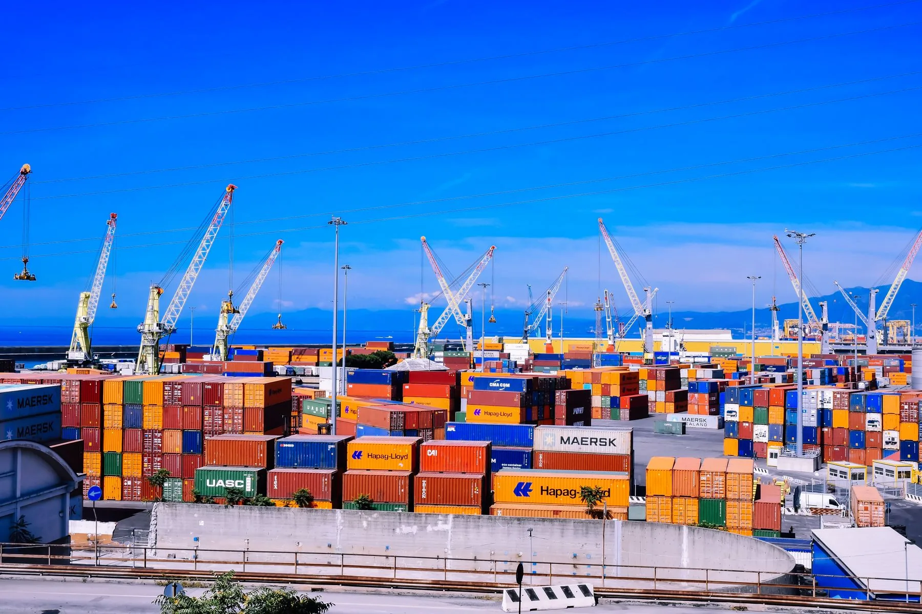 Shipping containers and cranes at a cargo port