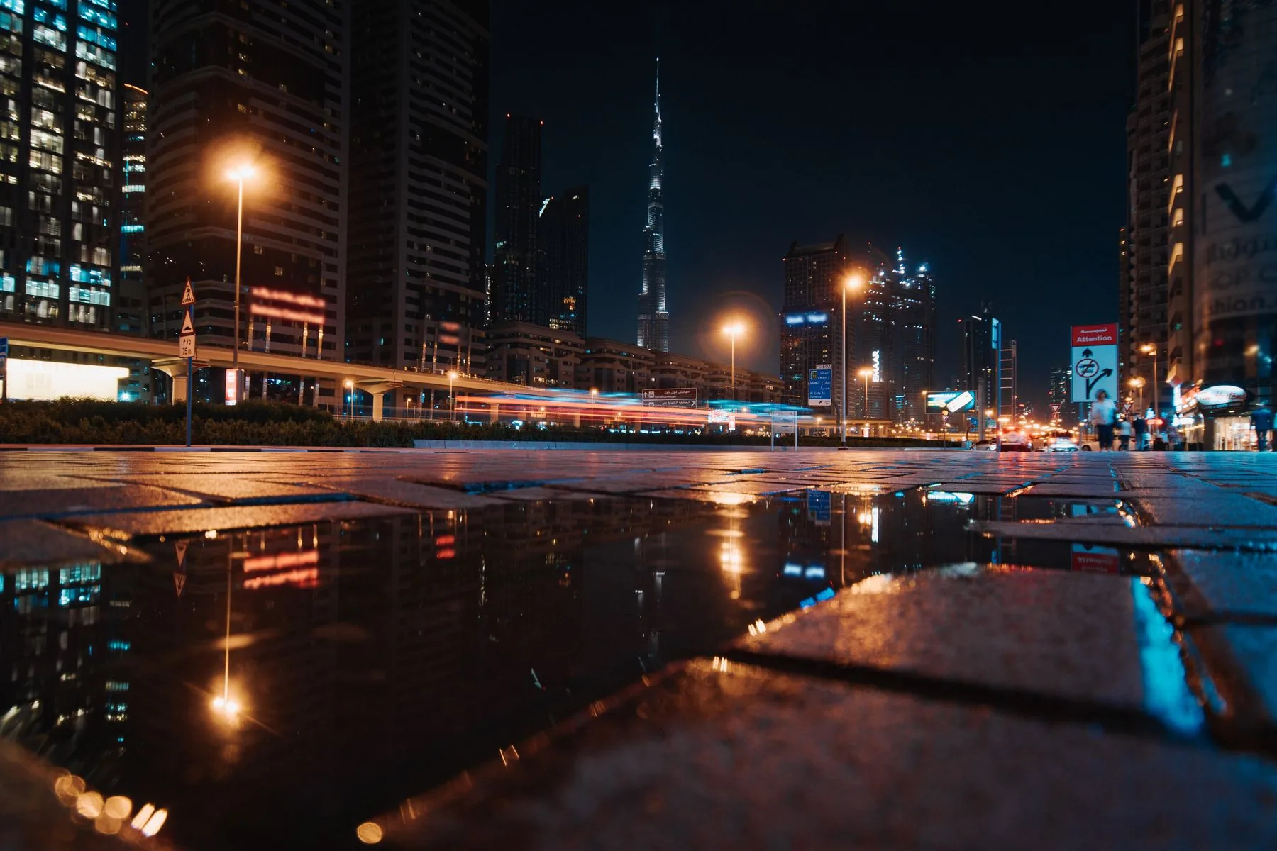 Dubai skyline reflected in the water at night