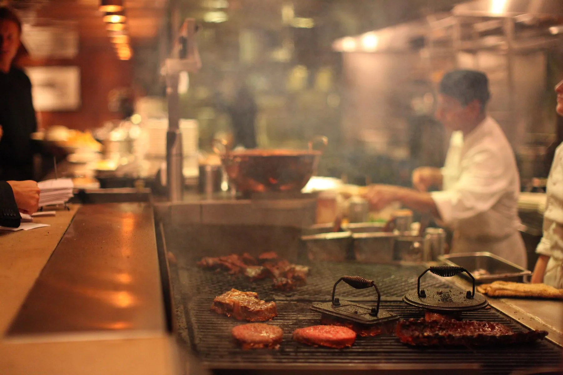 Chefs preparing food in a professional kitchen